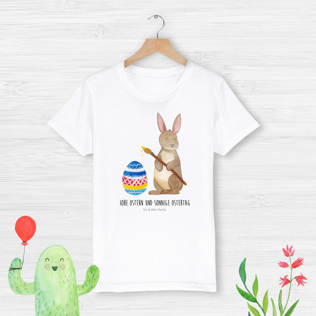 Organic Kinder T-Shirt Hase Eiermalen Kinder T-Shirt, Kinder T-Shirt Mädchen, Kinder T-Shirt Jungen, Ostern, Osterhase, Ostergeschenke, Osternest, Osterdeko, Geschenke zu Ostern, Ostern Geschenk, Ostergeschenke Kinder, Ostern Kinder, Frohe Ostern, Ostergrüße, Osterblume, Osterei, bemalte Ostereier, Hase, Kaninchen, Eiermalen