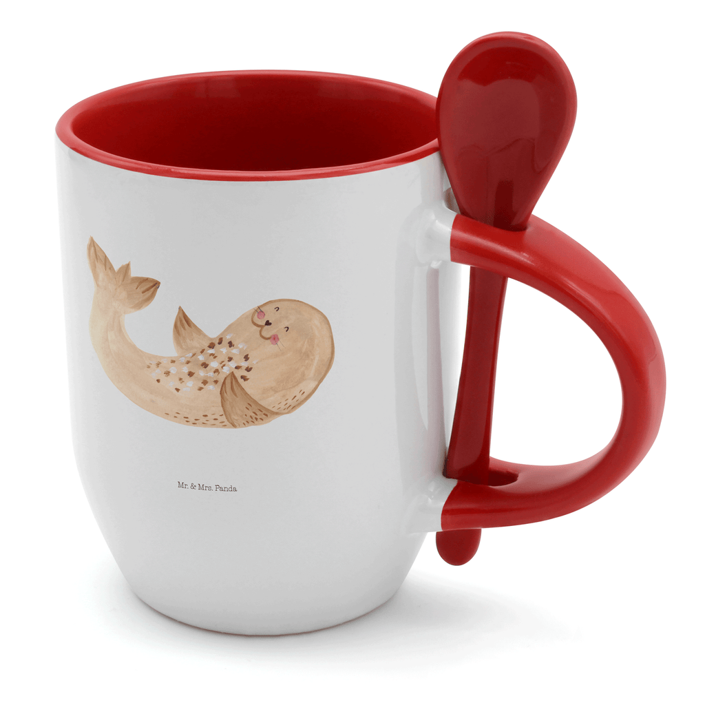 Tasse mit Löffel Robbe liegend Tasse, Kaffeetasse, Tassen, Tasse mit Spruch, Kaffeebecher, Tasse mit Löffel, Tiermotive, Gute Laune, lustige Sprüche, Tiere, Robbe, Robben, Seehund, Strand, Meerestier, Ostsee, Nordsee, Lachen, Freude