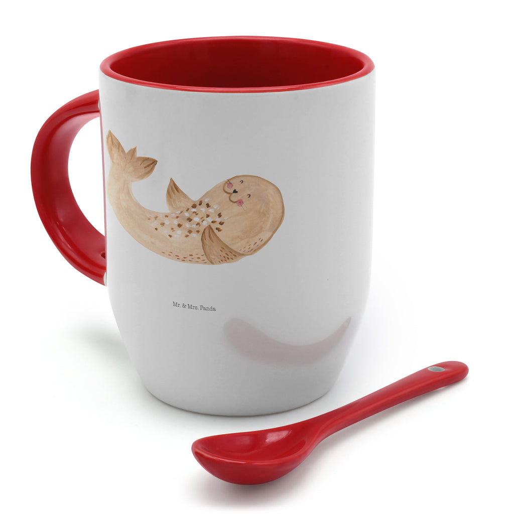 Tasse mit Löffel Robbe liegend Tasse, Kaffeetasse, Tassen, Tasse mit Spruch, Kaffeebecher, Tasse mit Löffel, Tiermotive, Gute Laune, lustige Sprüche, Tiere, Robbe, Robben, Seehund, Strand, Meerestier, Ostsee, Nordsee, Lachen, Freude