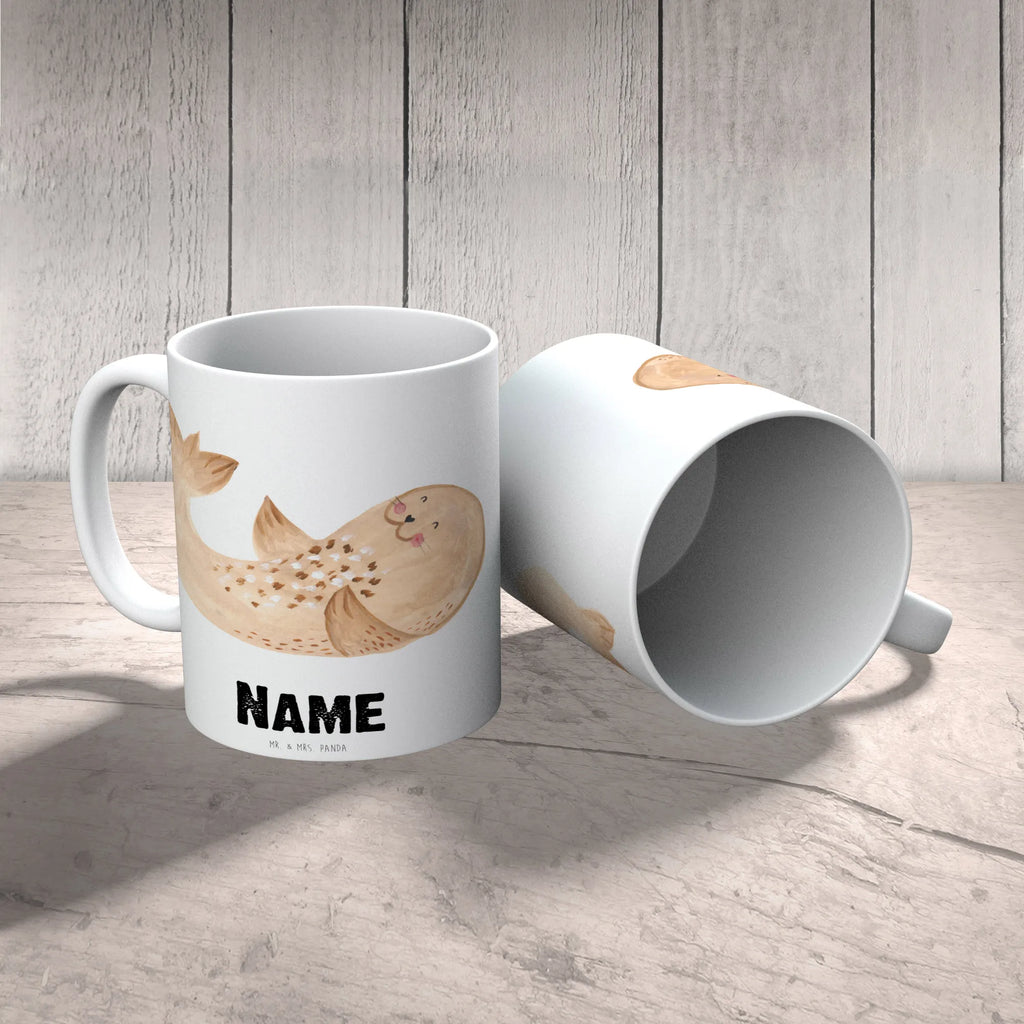 Personalisierte Tasse Robbe Liegen Personalisierte Tasse, Namenstasse, Wunschname, Personalisiert, Tasse, Namen, Drucken, Tasse mit Namen, Tiermotive, Gute Laune, lustige Sprüche, Tiere, Robbe, Robben, Seehund, Strand, Meerestier, Ostsee, Nordsee, Lachen, Freude