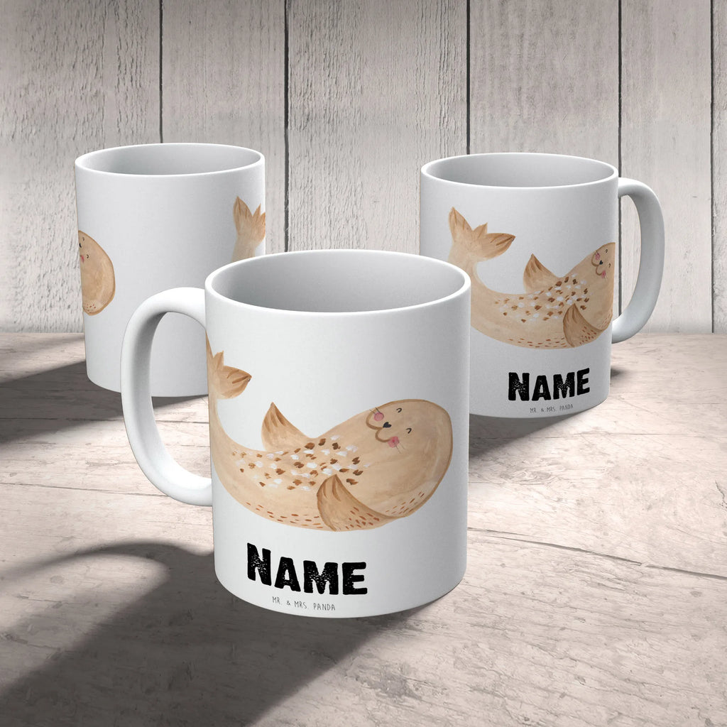 Personalisierte Tasse Robbe Liegen Personalisierte Tasse, Namenstasse, Wunschname, Personalisiert, Tasse, Namen, Drucken, Tasse mit Namen, Tiermotive, Gute Laune, lustige Sprüche, Tiere, Robbe, Robben, Seehund, Strand, Meerestier, Ostsee, Nordsee, Lachen, Freude