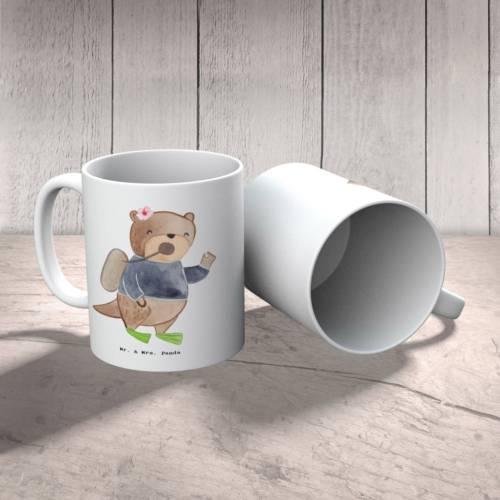 Tasse Tauchlehrerin mit Herz Tasse, Kaffeetasse, Teetasse, Becher, Kaffeebecher, Teebecher, Keramiktasse, Porzellantasse, Büro Tasse, Geschenk Tasse, Tasse Sprüche, Tasse Motive, Kaffeetassen, Tasse bedrucken, Designer Tasse, Cappuccino Tassen, Schöne Teetassen, Beruf, Ausbildung, Jubiläum, Abschied, Rente, Kollege, Kollegin, Geschenk, Schenken, Arbeitskollege, Mitarbeiter, Firma, Danke, Dankeschön