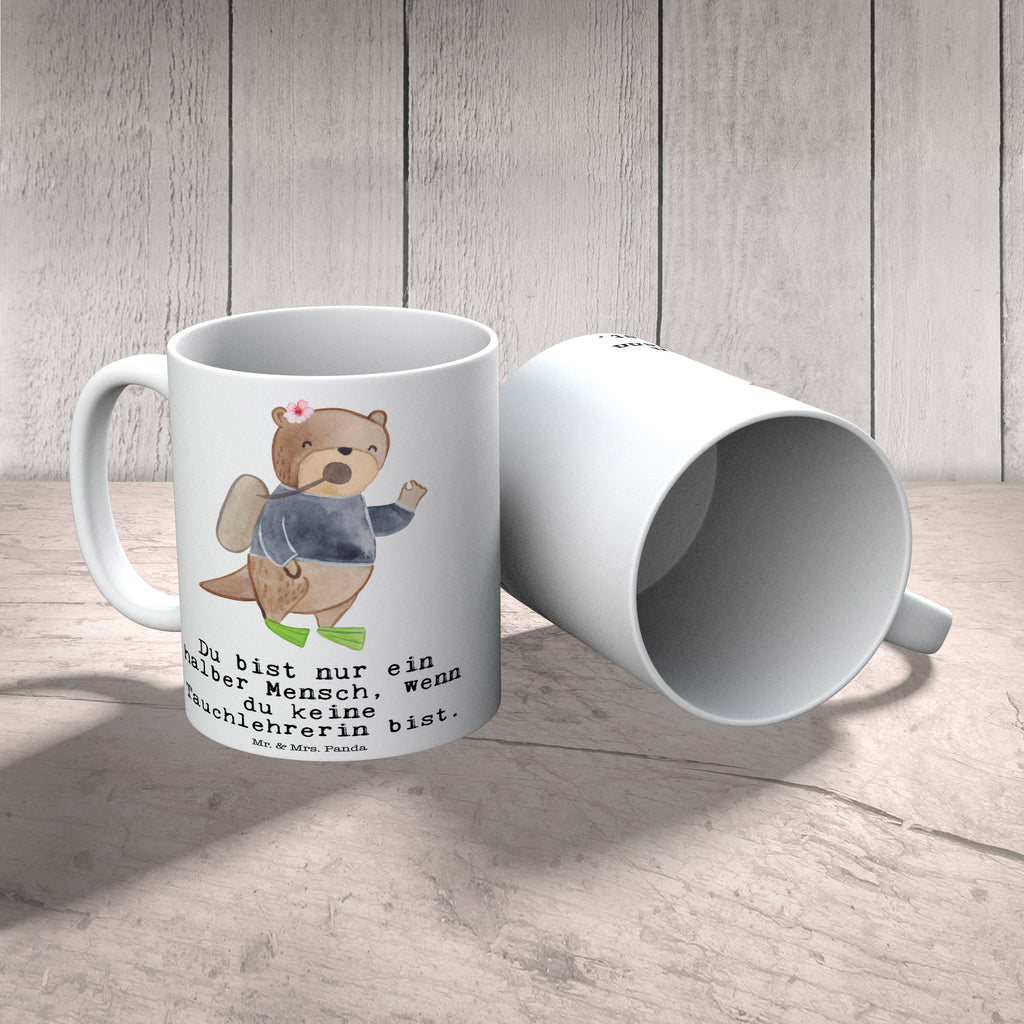 Tasse Tauchlehrerin mit Herz Tasse, Kaffeetasse, Teetasse, Becher, Kaffeebecher, Teebecher, Keramiktasse, Porzellantasse, Büro Tasse, Geschenk Tasse, Tasse Sprüche, Tasse Motive, Kaffeetassen, Tasse bedrucken, Designer Tasse, Cappuccino Tassen, Schöne Teetassen, Beruf, Ausbildung, Jubiläum, Abschied, Rente, Kollege, Kollegin, Geschenk, Schenken, Arbeitskollege, Mitarbeiter, Firma, Danke, Dankeschön