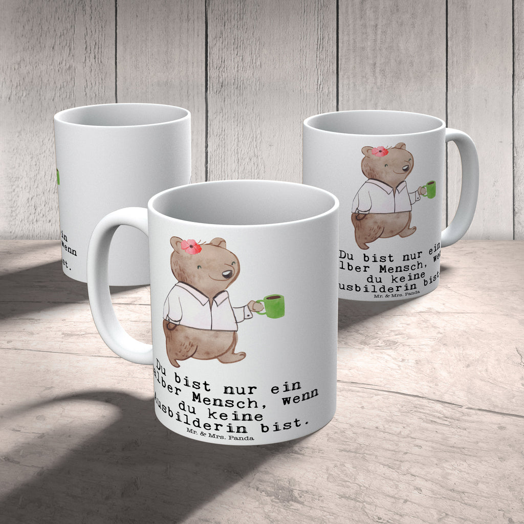 Tasse Ausbilderin mit Herz Tasse, Kaffeetasse, Teetasse, Becher, Kaffeebecher, Teebecher, Keramiktasse, Porzellantasse, Büro Tasse, Geschenk Tasse, Tasse Sprüche, Tasse Motive, Kaffeetassen, Tasse bedrucken, Designer Tasse, Cappuccino Tassen, Schöne Teetassen, Beruf, Ausbildung, Jubiläum, Abschied, Rente, Kollege, Kollegin, Geschenk, Schenken, Arbeitskollege, Mitarbeiter, Firma, Danke, Dankeschön, Ausbilderin, Tutorin, Ausbilderprüfung