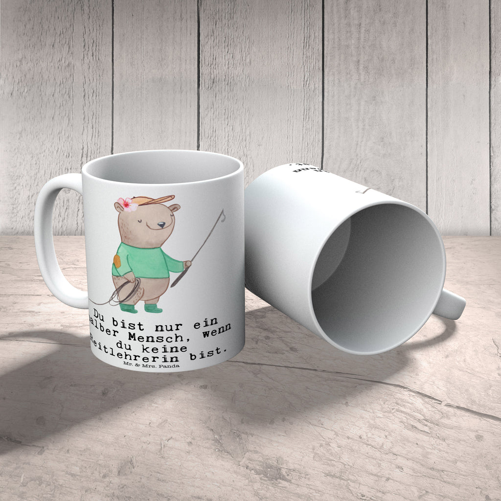 Tasse Reitlehrerin mit Herz Tasse, Kaffeetasse, Teetasse, Becher, Kaffeebecher, Teebecher, Keramiktasse, Porzellantasse, Büro Tasse, Geschenk Tasse, Tasse Sprüche, Tasse Motive, Kaffeetassen, Tasse bedrucken, Designer Tasse, Cappuccino Tassen, Schöne Teetassen, Beruf, Ausbildung, Jubiläum, Abschied, Rente, Kollege, Kollegin, Geschenk, Schenken, Arbeitskollege, Mitarbeiter, Firma, Danke, Dankeschön